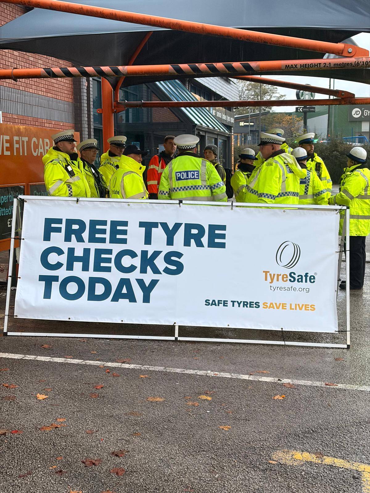 Operation ACT team beside a free tyre checks banner