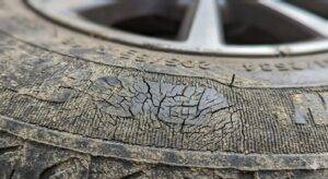 Close-up of tyre sidewall showing fine cracks